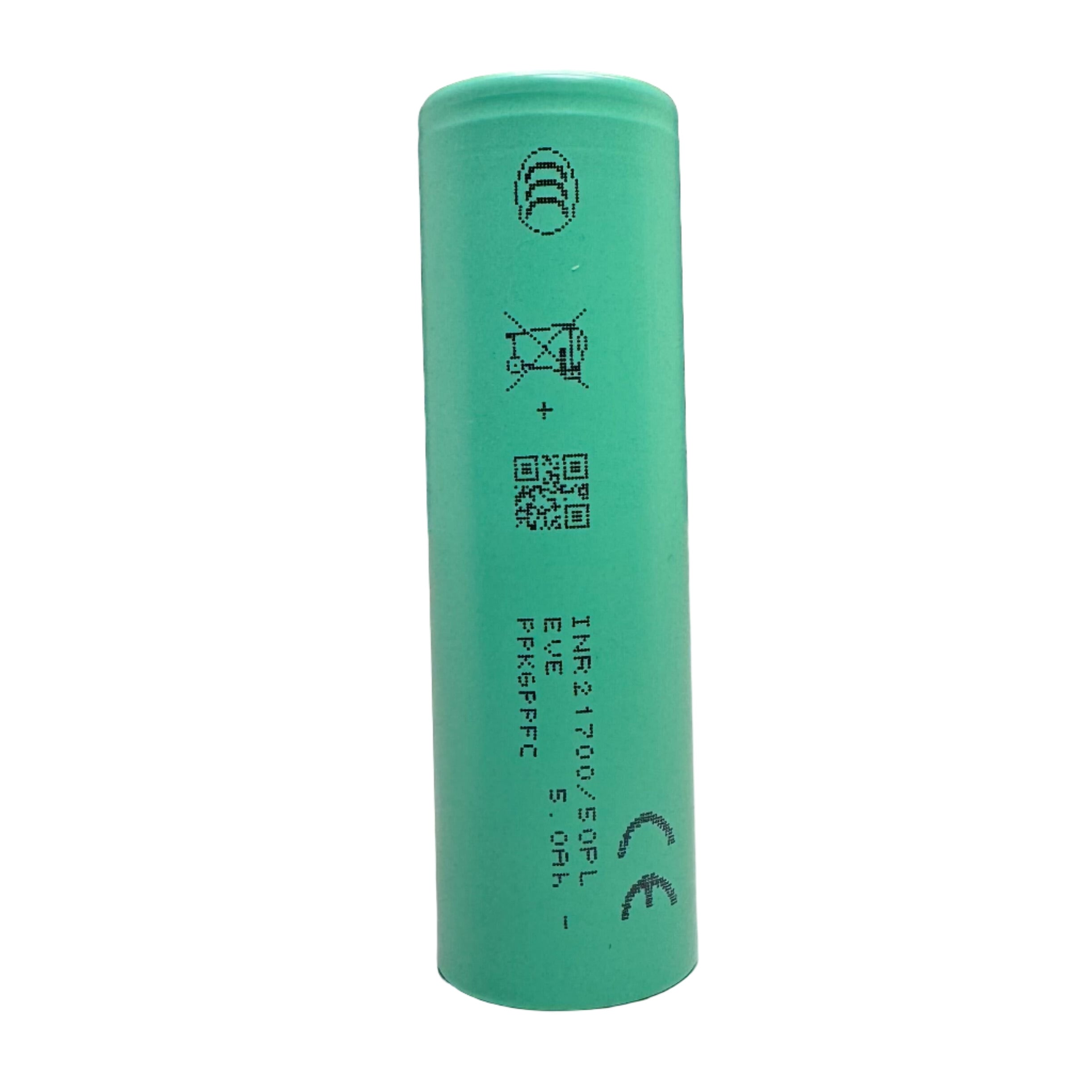 Green battery on a light gray surface with a dark background